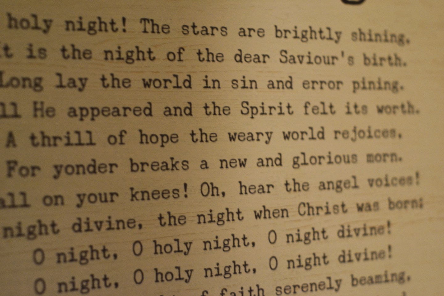 a close up of a poem on a wall
